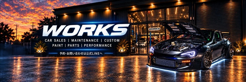 株式会社ワークス公式サイトのメインビジュアル・WORKSの建物とロゴ